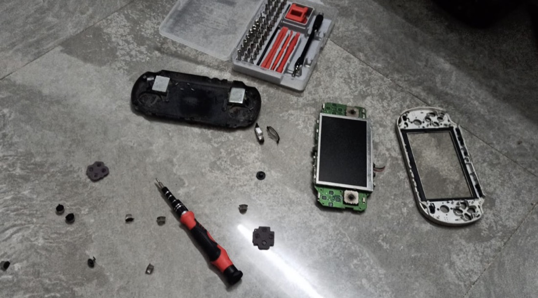 A disassembled PSP mid-repair
